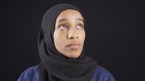 Portrait-of-unhappy-and-thoughtful-African-muslim-young-woman-in-hijab.